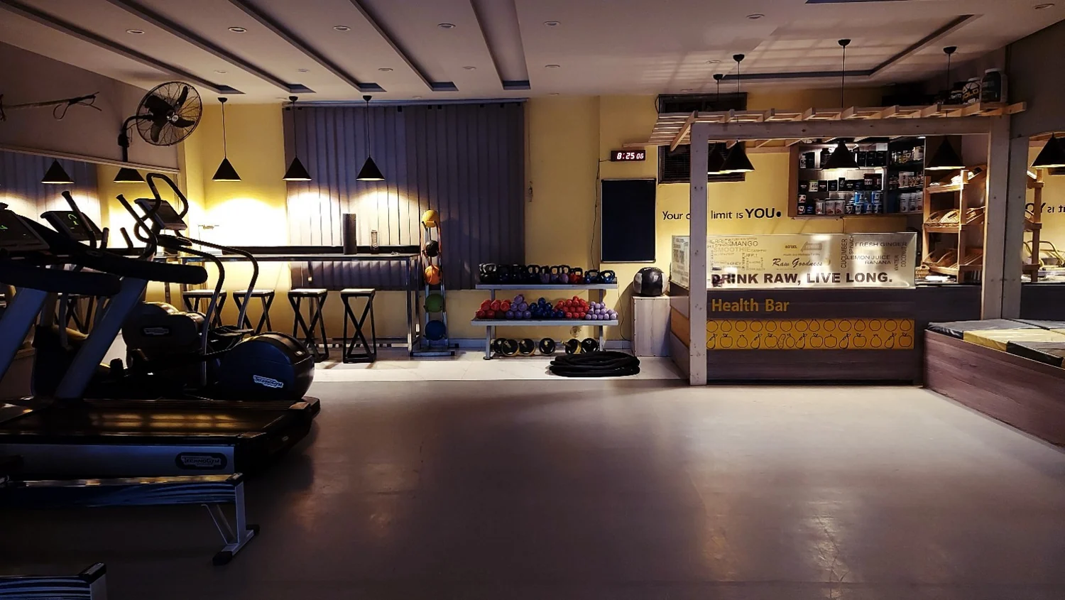 Refuel fitness and wellness facility with cardio equipment and health bar