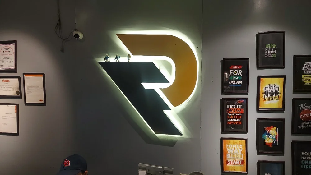 Illuminated Refuel logo inside the facility